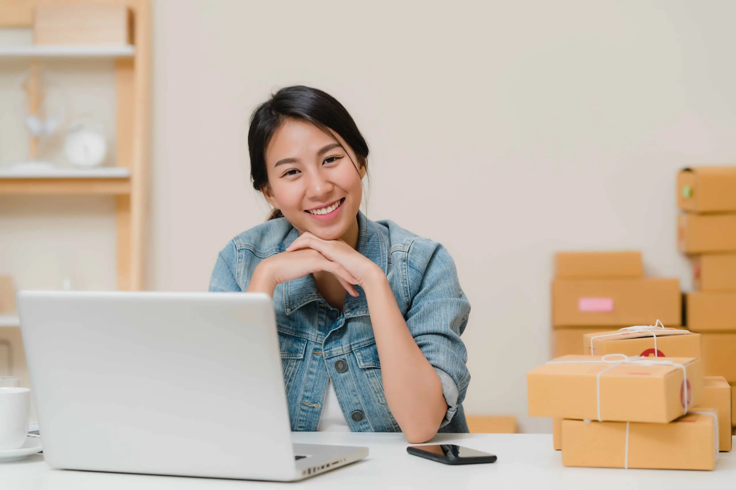 Business woman feeling happy smiling and looking to camera while